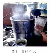 1 引言  山東魯碧建材有限公司2號(hào)輥磨為德國(guó)進(jìn)口萊歇磨，主要用于生產(chǎn)礦渣微粉，減速機(jī)采用弗蘭德品牌，型號(hào)為：KMPP651，其結(jié)構(gòu)為一級(jí)傘齒加兩級(jí)行星傳動(dòng)。2013年3月9日，該減速機(jī)因功率過(guò)高報(bào)警，而且潤(rùn)滑系統(tǒng)回油溫度急劇升高，晚上23：25減速機(jī)潤(rùn)滑站過(guò)濾器壓差高報(bào)警，整個(gè)系統(tǒng)跳停。檢查過(guò)濾器濾網(wǎng)時(shí)發(fā)現(xiàn)有大量的黃色銅屑，經(jīng)化驗(yàn)銅屑成分為CuAl10Ni查閱設(shè)備圖紙推測(cè)該合金來(lái)自二級(jí)行星輪中的銅瓦。經(jīng)過(guò)咨詢，弗蘭德專家給出了同樣的判斷，并提供了具體的解決方案。隨后， 山東魯碧建材有限公司按照弗蘭德公司出具的方案對(duì)該減速機(jī)進(jìn)行了搶修。目前該減速機(jī)運(yùn)行接近兩個(gè)月且效果良好?，F(xiàn)將具體原因、修復(fù)方案及預(yù)防措施簡(jiǎn)單描述。  2 原因分析  該減速機(jī)自2008年2月份開始使用，到現(xiàn)在已運(yùn)轉(zhuǎn)5年多，運(yùn)轉(zhuǎn)率接近90%，因此設(shè)備或多或少存在老化問(wèn)題，尤其是里面的合金瓦，由于自身硬度較低，一旦潤(rùn)滑不良很容易造成損傷。在拆檢減速機(jī)時(shí)發(fā)現(xiàn)二級(jí)行星有一個(gè)行星輪堆積了大量的合金，且無(wú)法轉(zhuǎn)動(dòng)，證明我們的判斷正確。在對(duì)該行星輪拆檢中發(fā)現(xiàn)了以下三個(gè)問(wèn)題：（1）兩側(cè)的推力瓦嚴(yán)重?zé)g熔化（圖1）；（2）銅瓦處存積了大量油泥并將潤(rùn)滑油道堵塞，而且銅瓦整個(gè)開裂、軸向延展接近30mm（圖2）；（3）銷軸局部裂紋（圖3）。    根據(jù)以上損壞分析，銅瓦潤(rùn)滑油孔堵塞之后，造成銅瓦急劇升溫，溫度升高到一定程度使得銅瓦受熱開裂并且膨脹延展，最終與兩側(cè)的推力瓦接觸，推力瓦受到擠壓以后迅速升溫最終燒蝕，銷軸因此承受較大的扭矩及高溫，造成裂紋。  3 處理方案  推力瓦、銅瓦、銷軸的方案為按照尺寸重新制作備件。但在檢測(cè)齒輪時(shí)發(fā)現(xiàn)其內(nèi)孔圓柱度較差以至于變成橢圓，而且表面硬度下降，遠(yuǎn)遠(yuǎn)低于圖紙要求（HRC55+5）。我們聯(lián)系弗蘭德公司欲購(gòu)買該齒輪，對(duì)方回復(fù)該齒輪需要德國(guó)進(jìn)口，加工周期為6個(gè)月，而且為保證齒輪嚙合，建議6個(gè)齒輪一起更換。此時(shí)， 山東魯碧建材有限公司銷售正處于旺季，該輥磨每天生產(chǎn)3000t微粉，停機(jī)6個(gè)月對(duì)我們的損失可想而知。我們聯(lián)系弗蘭德總部專家要求給出整改方案。對(duì)方經(jīng)過(guò)詳細(xì)計(jì)算給出如下方案：擴(kuò)大齒輪內(nèi)孔直徑，再加一個(gè)過(guò)渡套，從而保證齒輪的硬度及裝配要求（圖5）。    3.1 過(guò)渡套材料選擇 過(guò)渡套材料采用42CrMo。該材料強(qiáng)度、淬透性高，韌性好，淬火時(shí)變形小，高溫時(shí)有高的蠕變強(qiáng)度和持久強(qiáng)度，用于制造要求強(qiáng)度更高和調(diào)質(zhì)截面更大的鍛件。  3.2 處理工藝    （1）鍛打：目的是減小殘留夾雜物的尺寸，使其成分趨于均勻，組織趨于致密，細(xì)化晶粒，改善鋼的性能。    （2）粗車：?jiǎn)芜吜?mm加工余量。    （3）著色探傷：目的是檢查工件是否有損傷，從而保證下一道工序順利進(jìn)行。    （4）完全退火：目的是使工件的內(nèi)部組織全部進(jìn)行重結(jié)晶，通過(guò)完全退火來(lái)細(xì)化晶粒，均勻組織，消除內(nèi)應(yīng)力，同時(shí)降低硬度，便于切削加工，并為加工后零件的淬火作好組織準(zhǔn)備（圖6）。    具體過(guò)程：零件在爐溫>800℃裝爐，立即通入甲醇：50~60ml/min、氮?dú)猓?~6m3/h；溫度升到850℃之后甲醇：35~45ml/min、氮?dú)猓?m3/h；保溫120min后隨爐冷降溫至650℃，停甲醇，氮?dú)猓?m3/h；降溫至550℃時(shí)出爐空冷。    （5）半精車：?jiǎn)芜?.75mm，從而滿足下一步淬火的淬硬層>0.5mm的要求。    （6）高頻淬火（圖7）：該套由于工作面是套的內(nèi)孔及兩個(gè)端面，硬度要求HRC58-62，淬硬層>0.5mm。因此，選擇高頻淬火，這樣既能局部熱處理，同時(shí)也滿足硬度要求。另外，高頻淬火時(shí)工件的冷卻至關(guān)重要，為保險(xiǎn)起見(jiàn)采用淬火液進(jìn)行冷卻；感應(yīng)器距離工件的位置也非常重要，離得太近容易造成感應(yīng)器受熱，堵塞冷卻水溢流孔，離得太遠(yuǎn)影響熱功率的傳遞，一般控制在3~5mm。       （7）精車外圓及內(nèi)孔：外圓最終尺寸為?330t6，內(nèi)孔最終尺寸為?330H6，這樣保證外圓與齒輪內(nèi)孔過(guò)盈配合，過(guò)盈量控制在0.2~0.3mm；內(nèi)孔與銅套間隙配合，間隙控制在0.1~0.12mm。    （8）精車端面：將過(guò)渡套與齒輪進(jìn)行冷裝之后，對(duì)過(guò)渡套的端面進(jìn)行精車，要求兩個(gè)端面與內(nèi)孔垂直度，圓跳度誤差控制在0.02mm以內(nèi)。 目前，該減速機(jī)已恢復(fù)生產(chǎn)兩個(gè)月，二級(jí)行星振動(dòng)值3~5mm/s，輥壓9.0MPa，比表面積440m2/kg，磨機(jī)產(chǎn)量也逐漸恢復(fù)到150t/h，運(yùn)轉(zhuǎn)狀況良好。  4 采取的措施  4.1 加強(qiáng)設(shè)備巡檢并采用先進(jìn)的檢測(cè)工具 該減速機(jī)恢復(fù)生產(chǎn)之后，我們加強(qiáng)了巡檢力度，購(gòu)買了先進(jìn)的在線巡檢儀，它不僅能對(duì)減速機(jī)振動(dòng)進(jìn)行檢測(cè)形成趨勢(shì)圖，而且還能進(jìn)行數(shù)據(jù)傳輸及保存，這樣我們就能夠通過(guò)趨勢(shì)圖來(lái)推斷減速機(jī)運(yùn)行狀況。  4.2 加強(qiáng)油品檢測(cè) 目前，我們每個(gè)月都要對(duì)潤(rùn)滑油進(jìn)行檢測(cè)，項(xiàng)目有粘度、機(jī)械雜質(zhì)、水分、污染等級(jí)等，通過(guò)對(duì)油樣的檢測(cè)，可以隨時(shí)掌握減速機(jī)內(nèi)部運(yùn)轉(zhuǎn)狀況，保證了潤(rùn)滑的可靠性。  4.3 提高磨機(jī)操作水平 喂料粒度控制在80mm以內(nèi)，這樣既能保證碾磨料層厚度避免磨機(jī)振動(dòng)，又能提高研磨效率；另外，加強(qiáng)選粉機(jī)轉(zhuǎn)速、喂料量、熱風(fēng)控制的調(diào)整，從而保證磨機(jī)穩(wěn)定順行。  4.4 選用材質(zhì)較好的濾芯 弗蘭德KMPP651減速機(jī)內(nèi)部全部為滑動(dòng)軸承，對(duì)潤(rùn)滑油的潔凈度要求比較高，一旦有異物進(jìn)入很容易造成油道堵塞。因此，濾芯的選用至關(guān)重要，我們現(xiàn)在選用的是力士樂(lè)25μm濾芯，使用效果很好。  5 結(jié)語(yǔ)  輥磨的穩(wěn)定運(yùn)行對(duì)減速機(jī)的使用壽命至關(guān)重要，減少輥磨運(yùn)行的振動(dòng)值，有利于減速機(jī)提高使用壽命；另外，定期檢測(cè)減速機(jī)各個(gè)軸瓦部位的振動(dòng)，并且定期對(duì)潤(rùn)滑油進(jìn)行檢測(cè)及檢查過(guò)濾網(wǎng)上有無(wú)雜質(zhì)，對(duì)提高減速機(jī)的穩(wěn)定順行也至關(guān)重要。